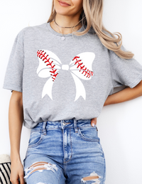a woman wearing a baseball shirt with a bow