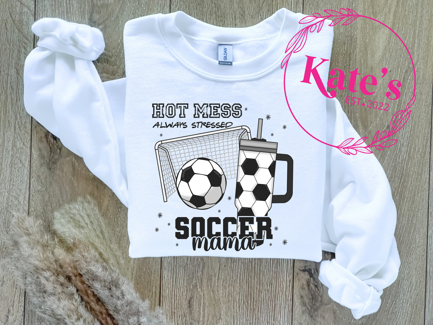 a white shirt with a soccer ball on it